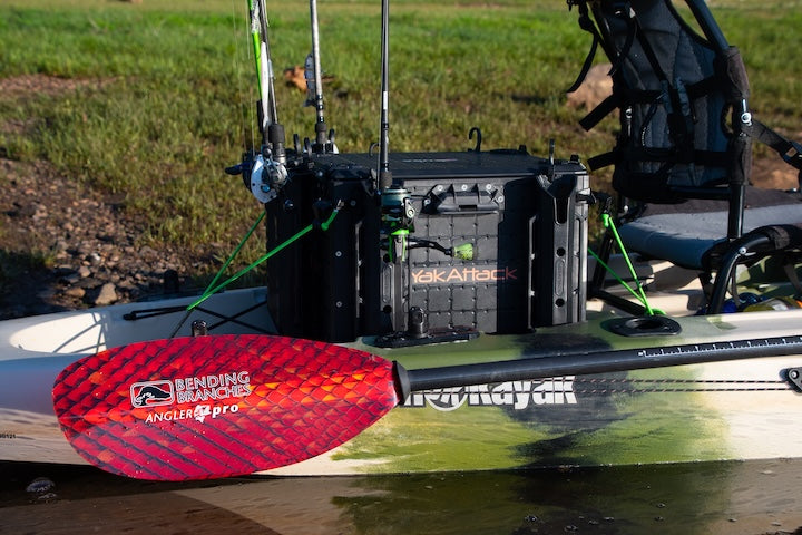 Bending Branches' Angler Pro in Copperhead is attached to the side of a fishing kayak loaded with gear