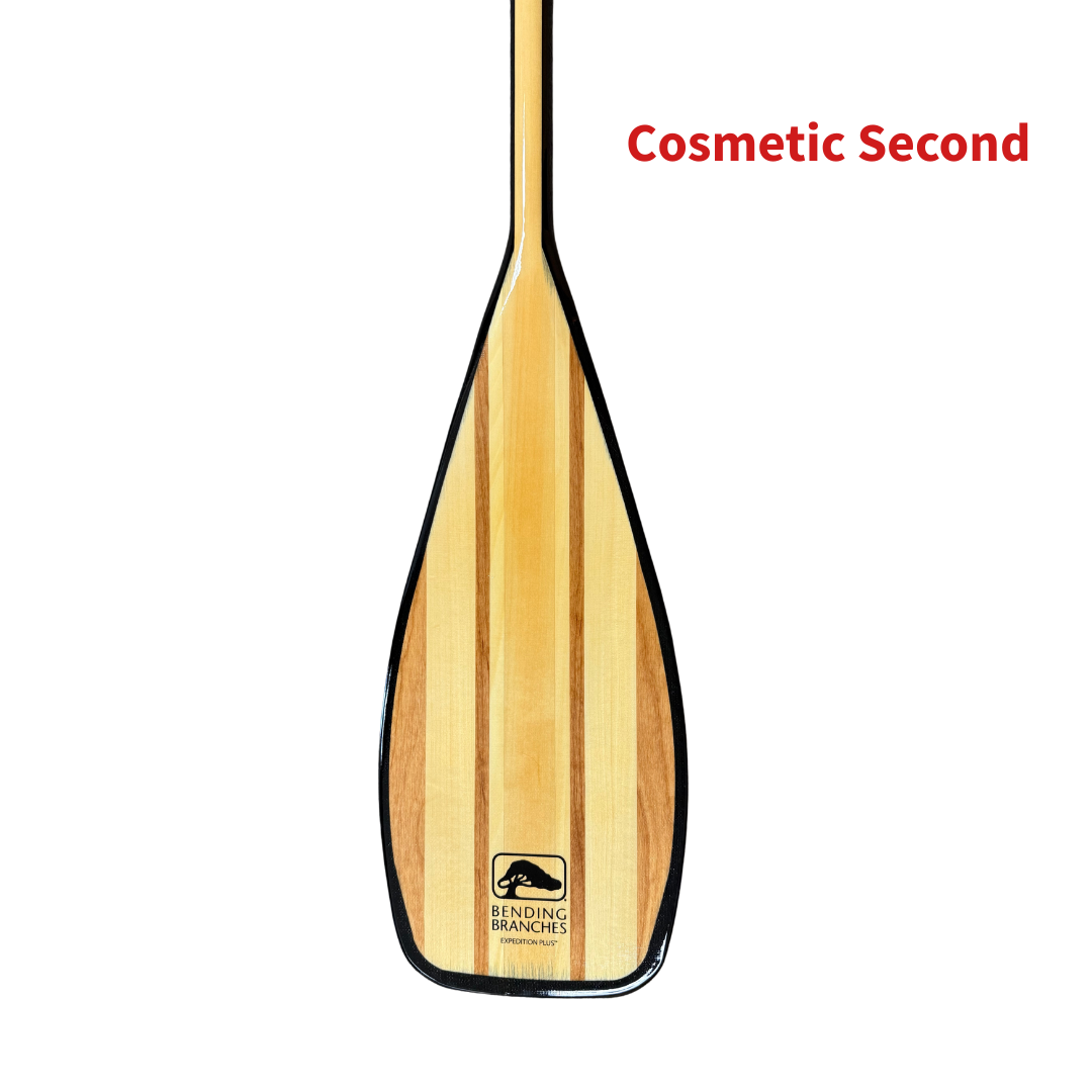 Wooden paddle with a brand logo on a white background, labeled 'Cosmetic Second'.